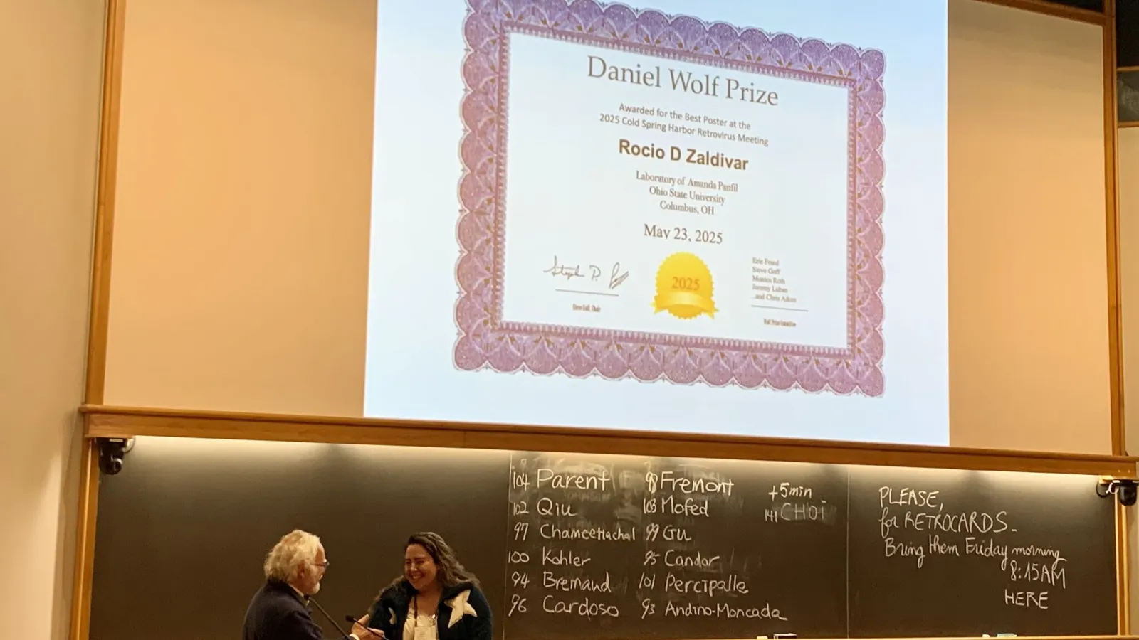 Rocio Zaldivar receiving award
