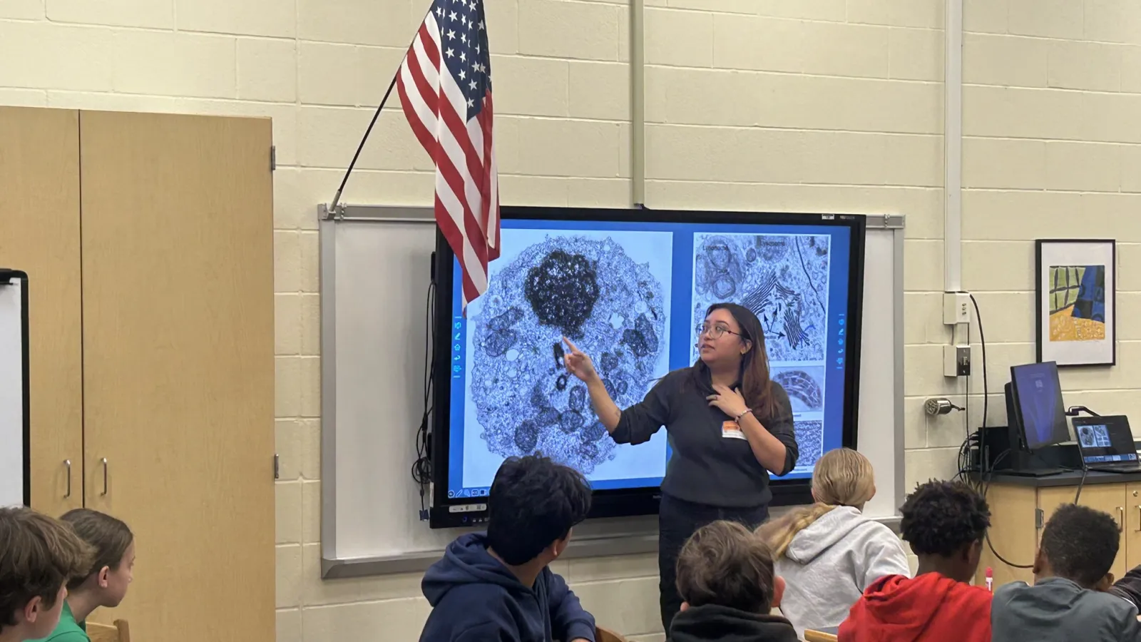 Carmen Rodriguez presenting in front of a classroom of students