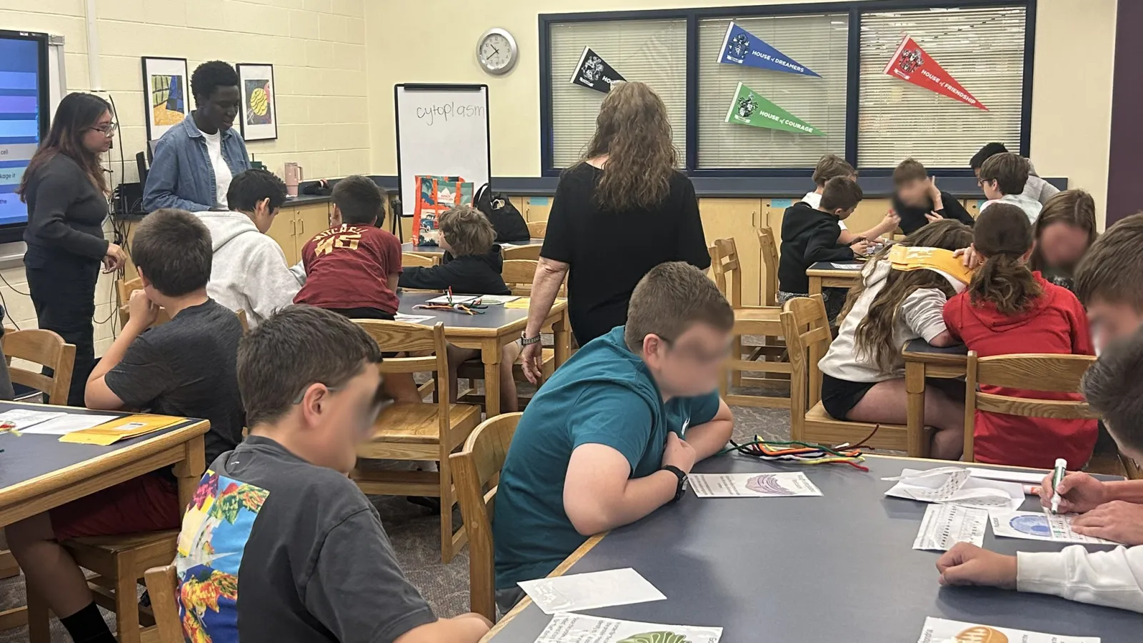 A class of students participating in the science activity