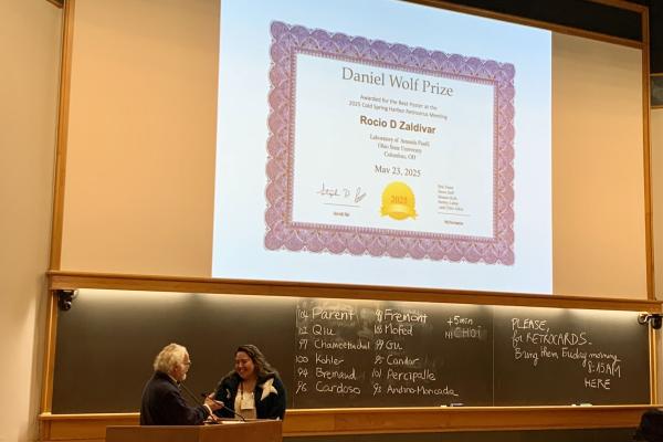 Rocio Zaldivar receiving award